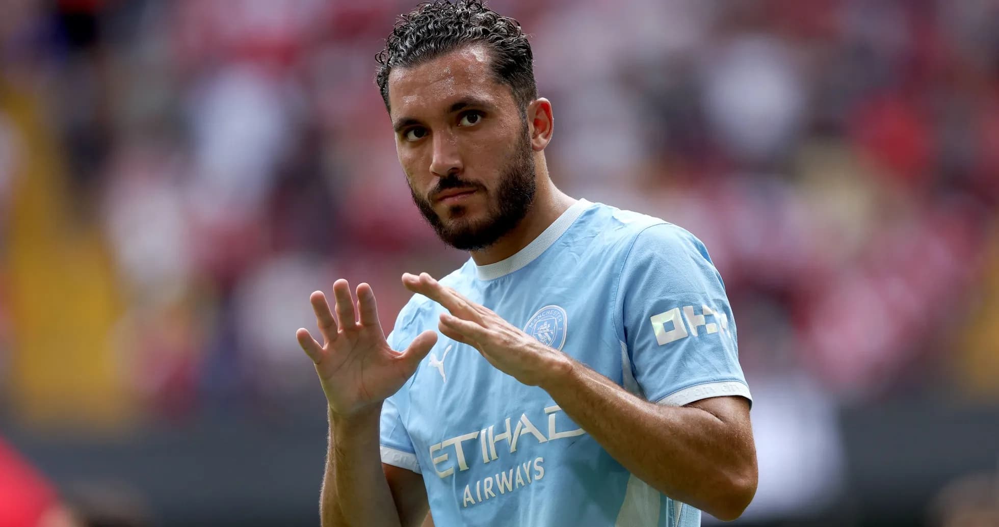 Player gesturing during match warm-up on field