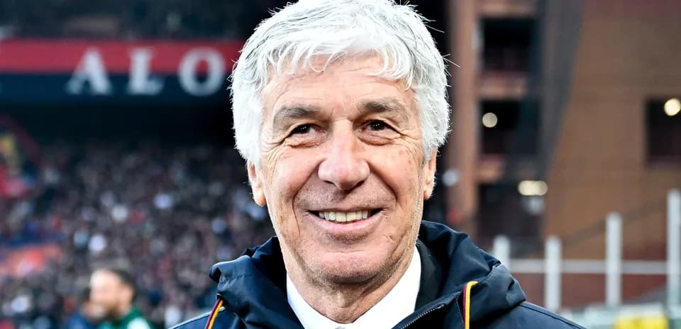 Smiling coach in front of stadium crowd