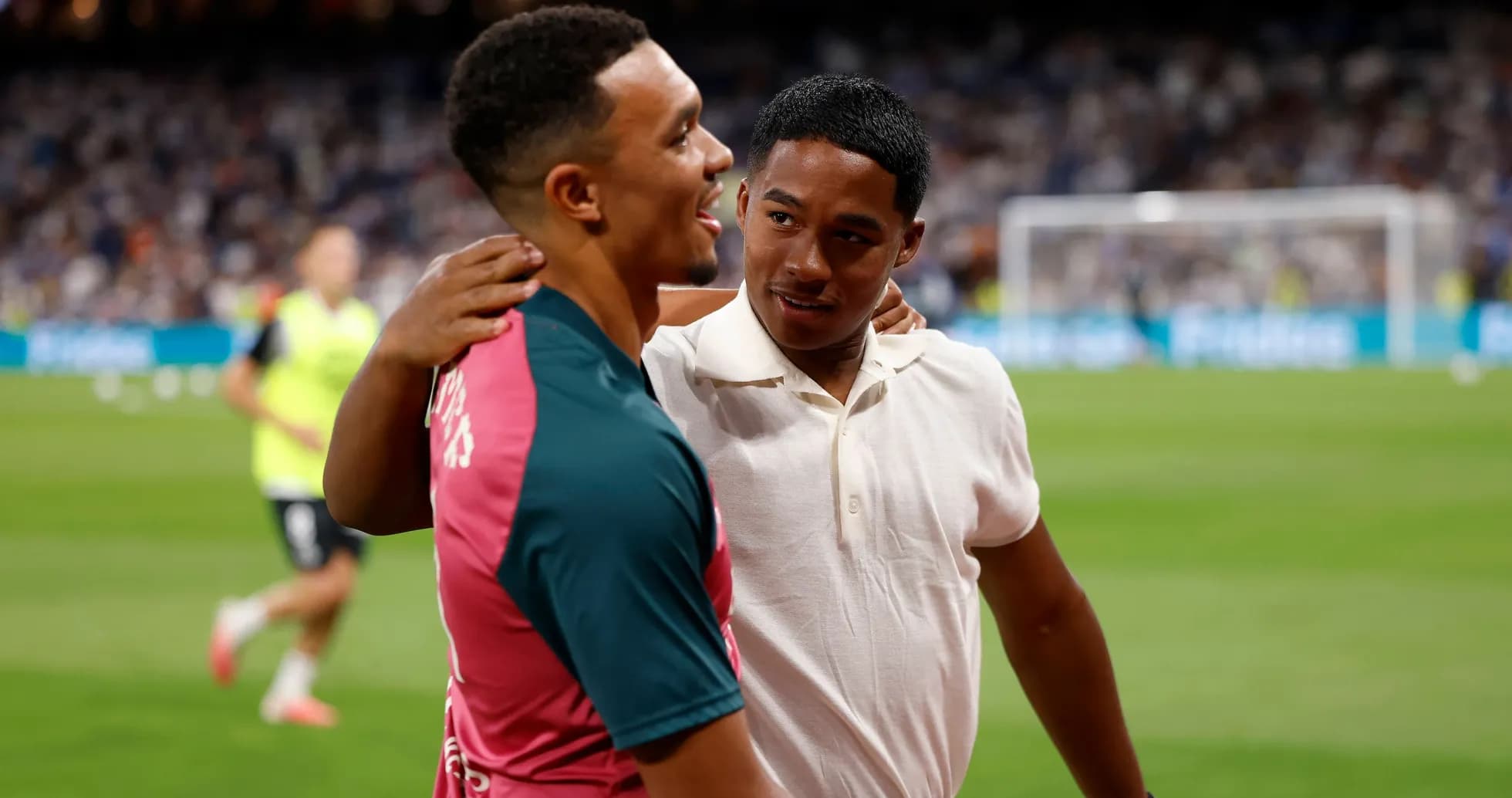 Two players interacting on the field before match