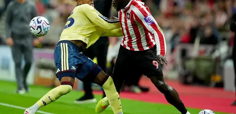Two players contesting the ball during a match