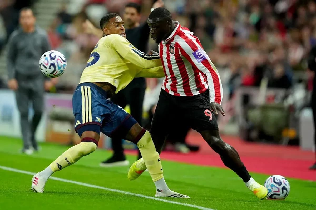 Two players contesting the ball during a match