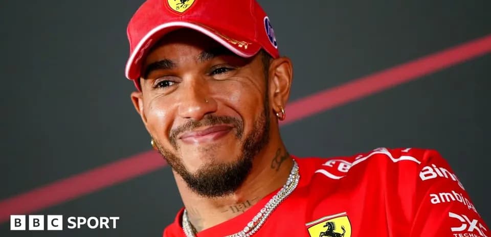 Driver wearing Ferrari cap during press event