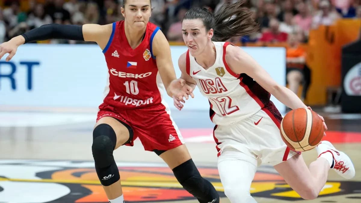 USA player dribbling past Czech player during game