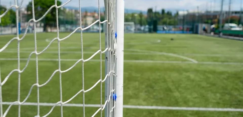 Close-up of soccer goal on grassy field