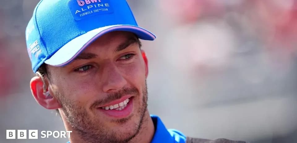 Driver wearing Alpine cap during race event