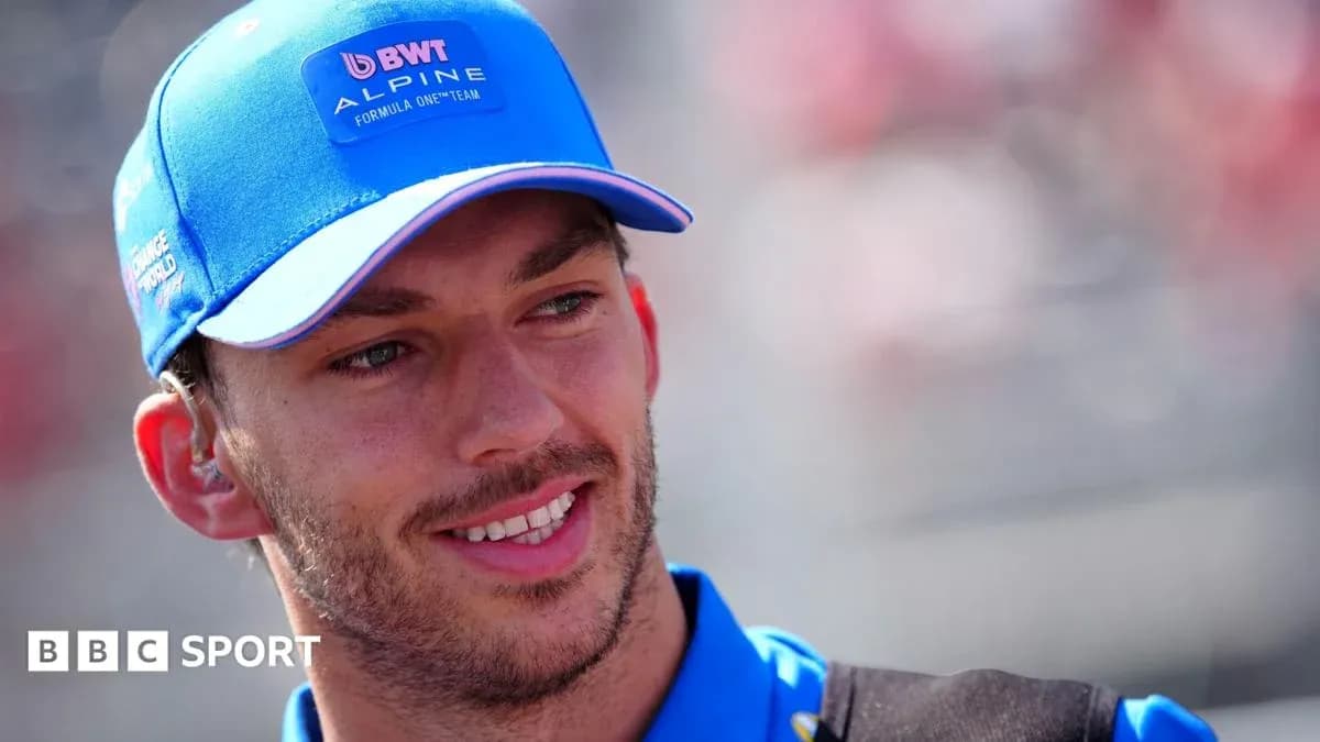 Driver wearing Alpine cap during race event