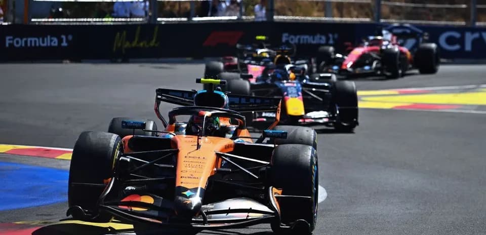 McLaren and Red Bull cars racing on track