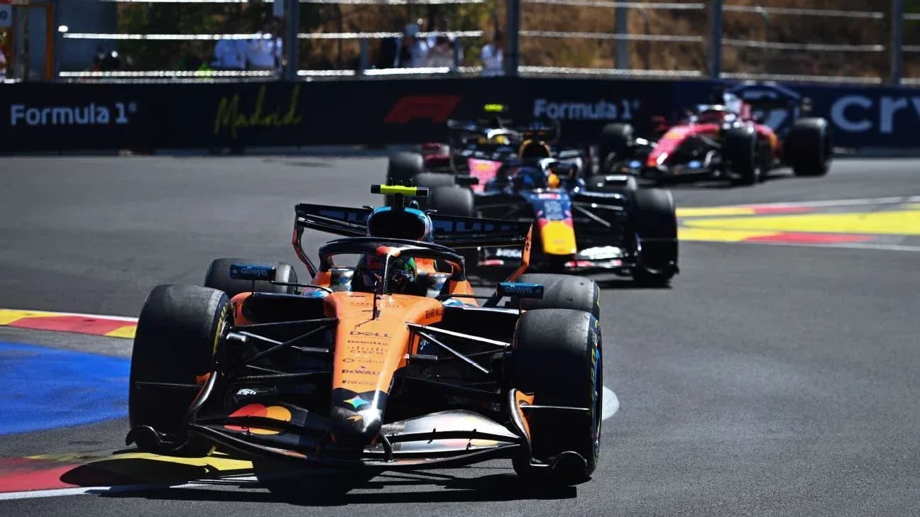 McLaren and Red Bull cars racing on track
