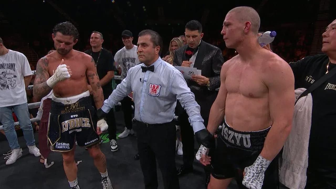 Boxers and referee in the ring after match