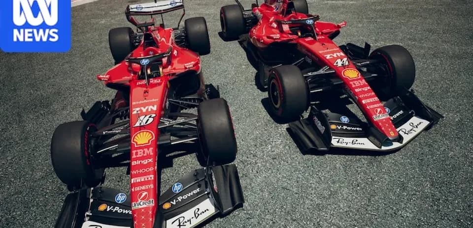 Two Ferrari F1 cars displayed on track