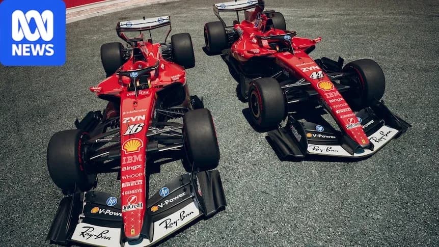 Two Ferrari F1 cars displayed on track