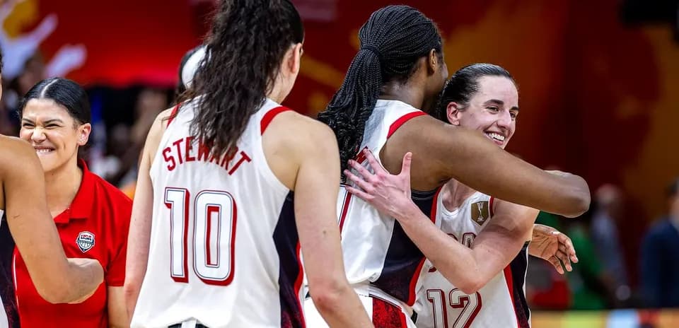 Players celebrating with hugs after a victory
