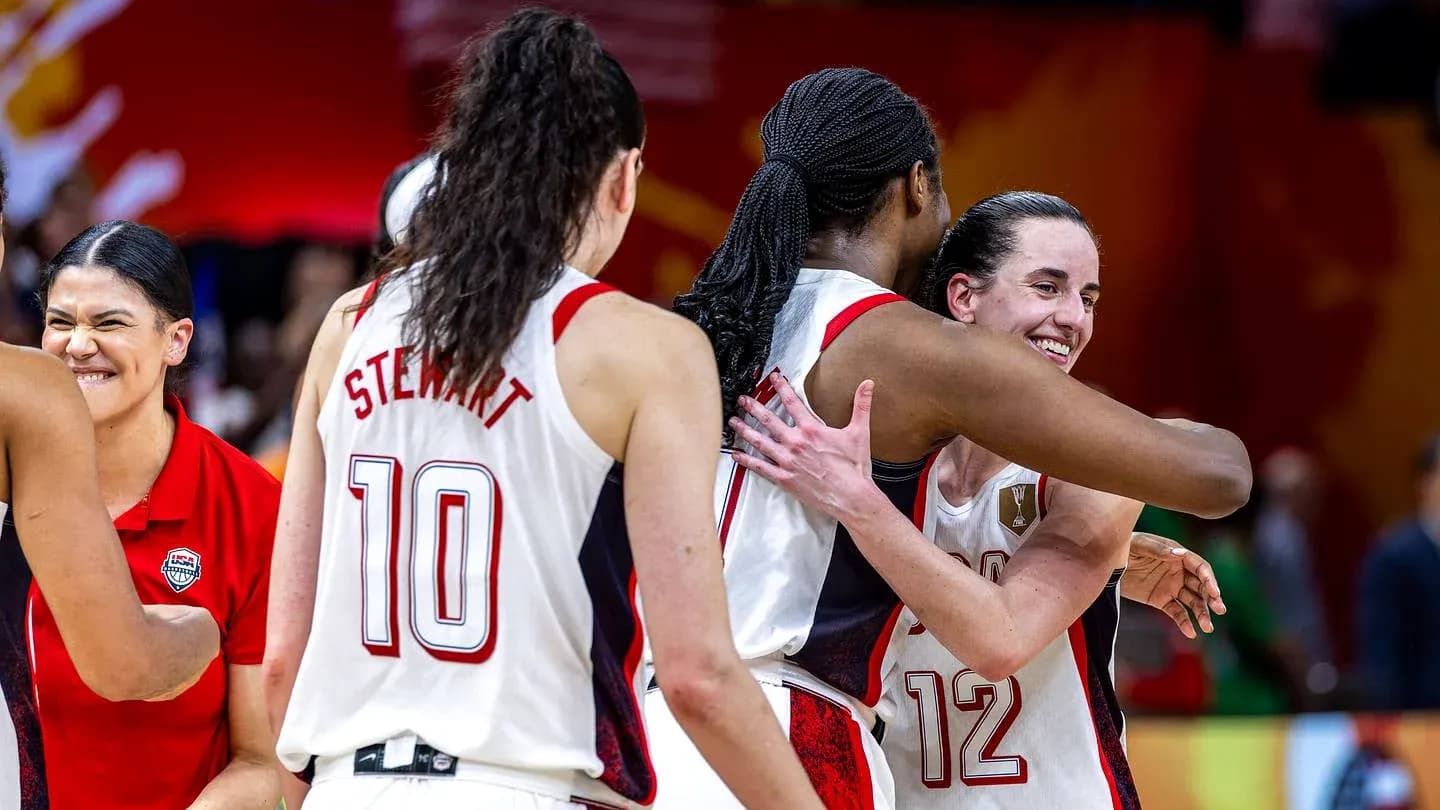 Players celebrating with hugs after a victory
