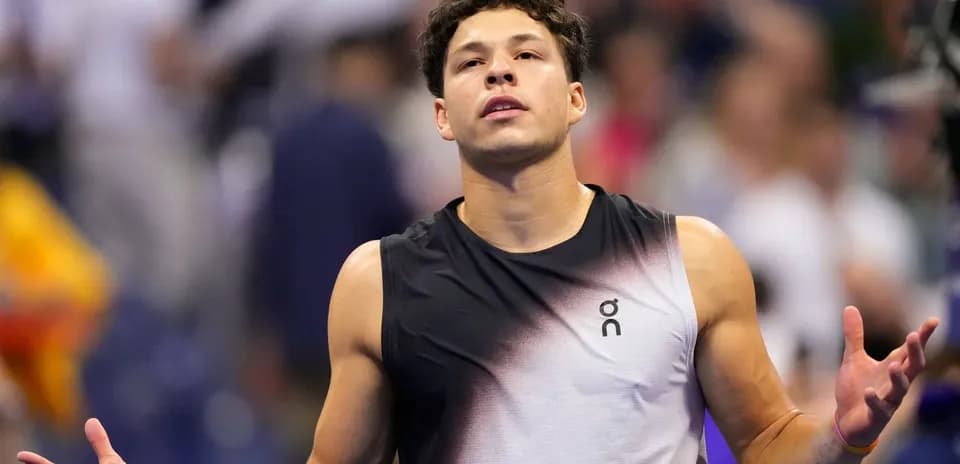 Tennis player gesturing during a match