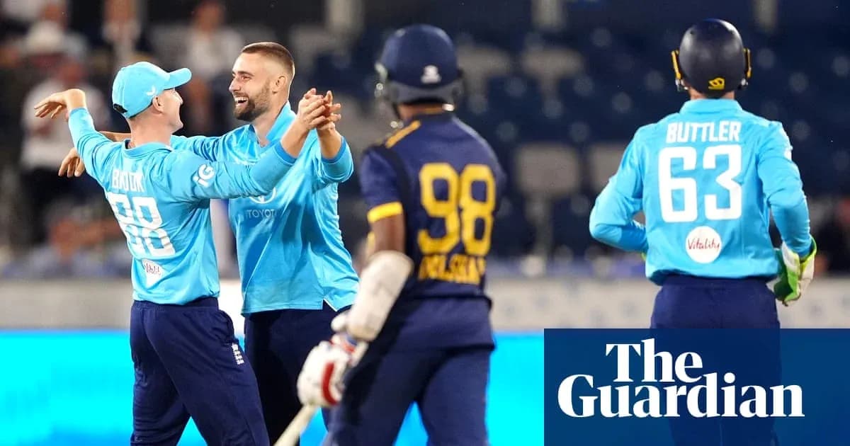 England players celebrating a wicket during match