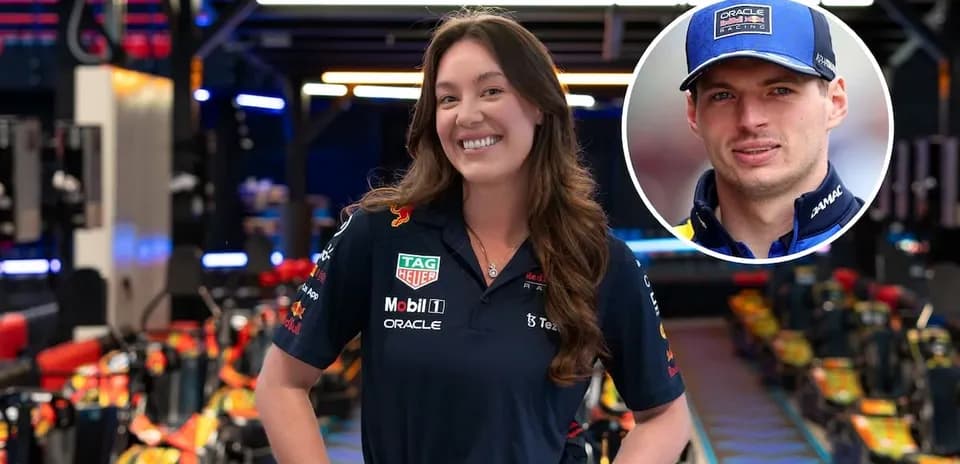 Team member smiling in Red Bull Racing garage