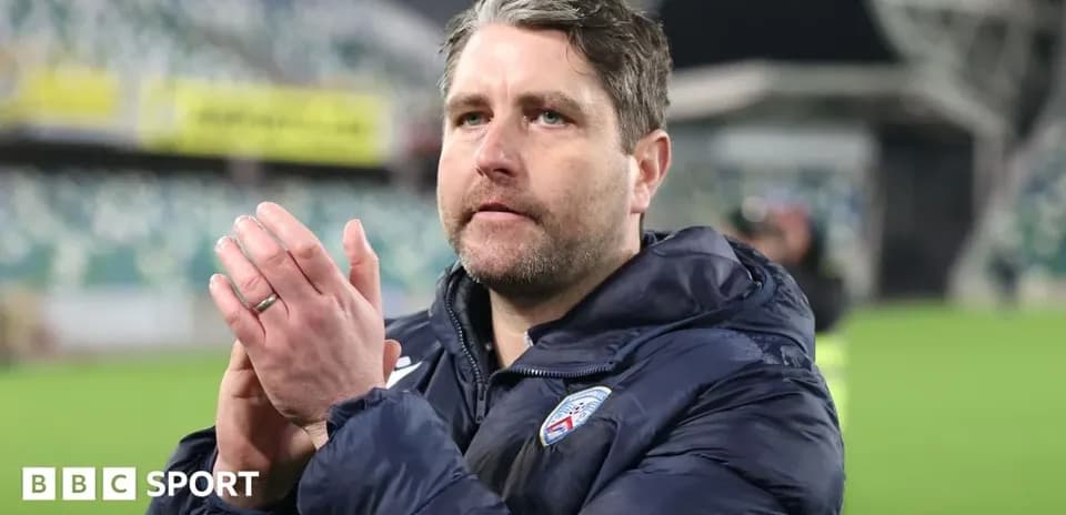 Coach applauding supporters after the match