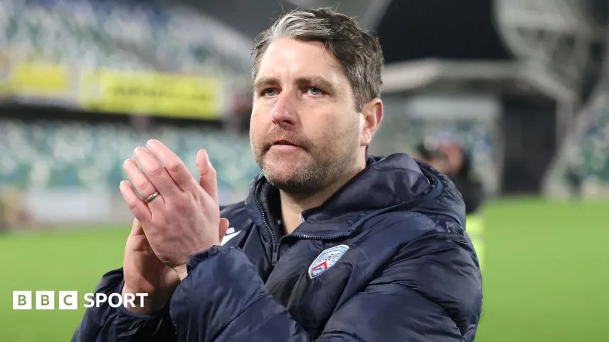 Coach applauding supporters after the match