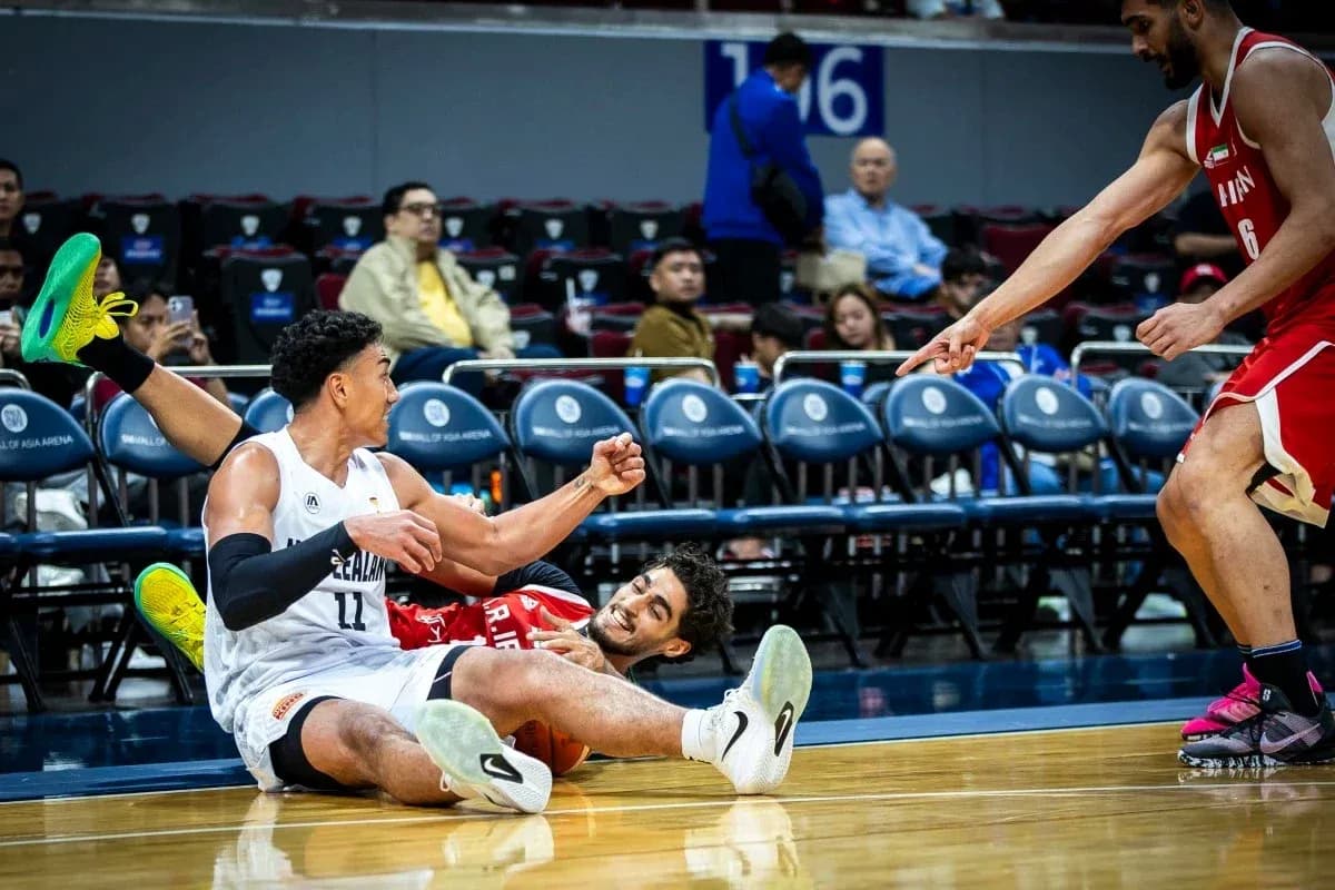 Players on the floor during intense basketball play