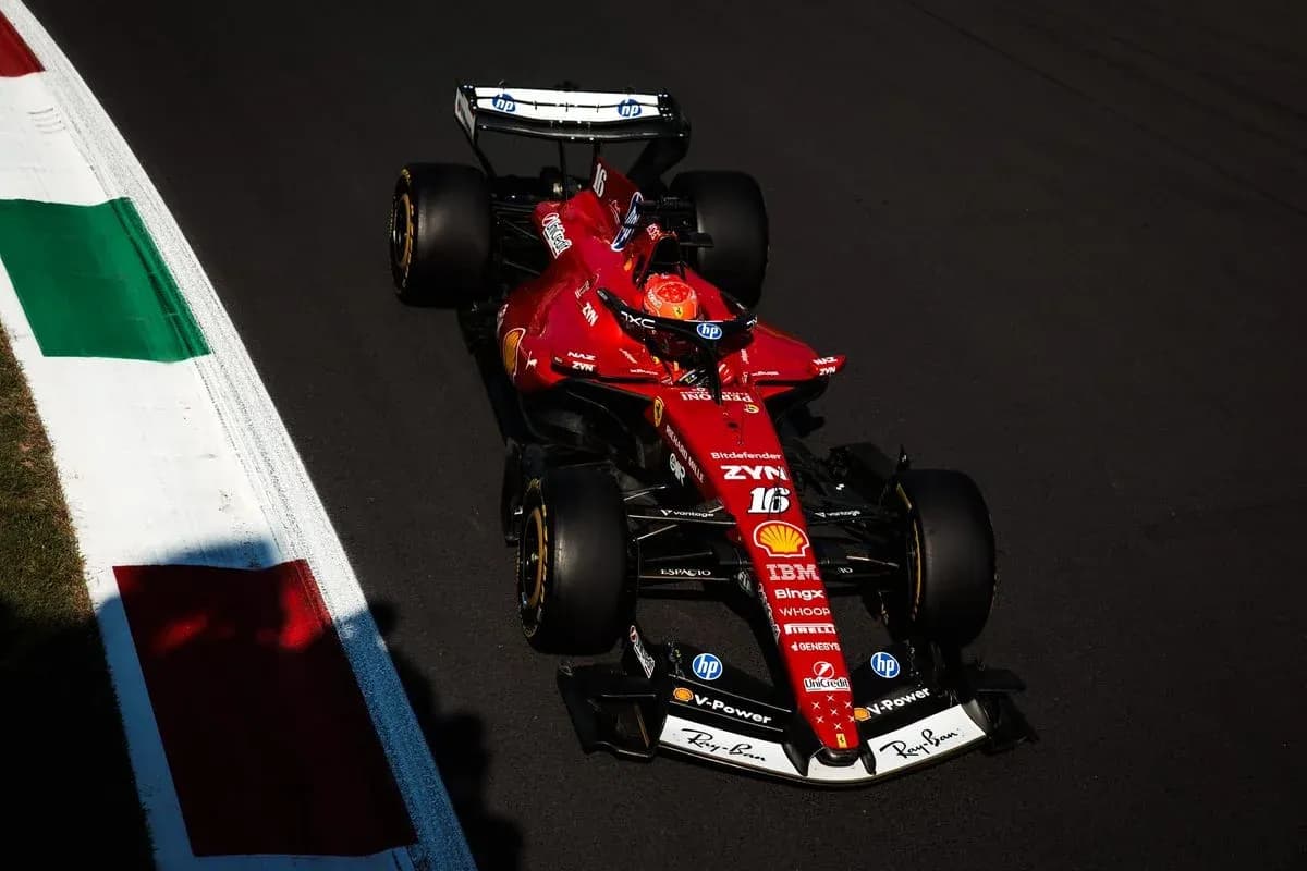 Ferrari F1 car navigating a track corner