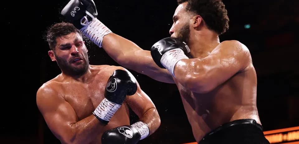 Boxers exchanging punches during a boxing match