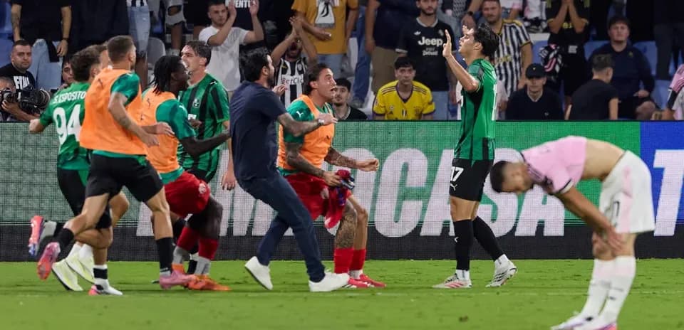 Sassuolo players celebrate after scoring against Juventus