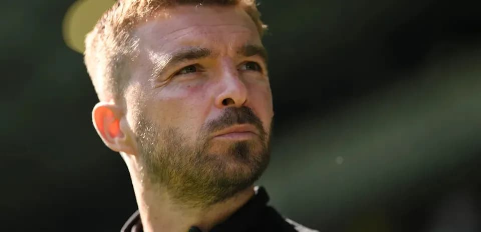 Coach looking thoughtful during training session