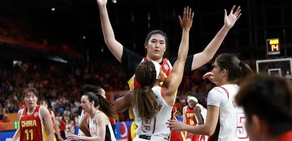 Players competing during basketball match action