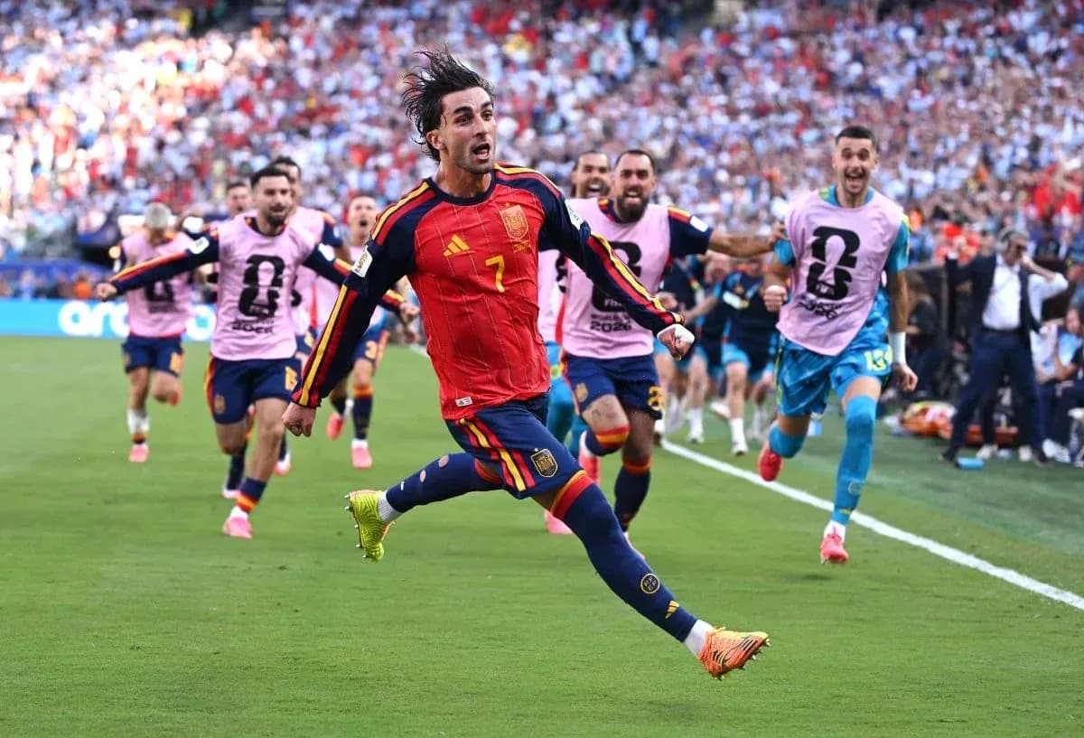 Spain player celebrating a goal with teammates