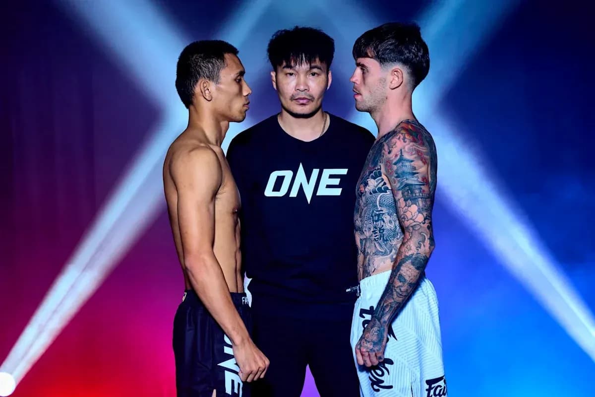 Two fighters facing off with official in between