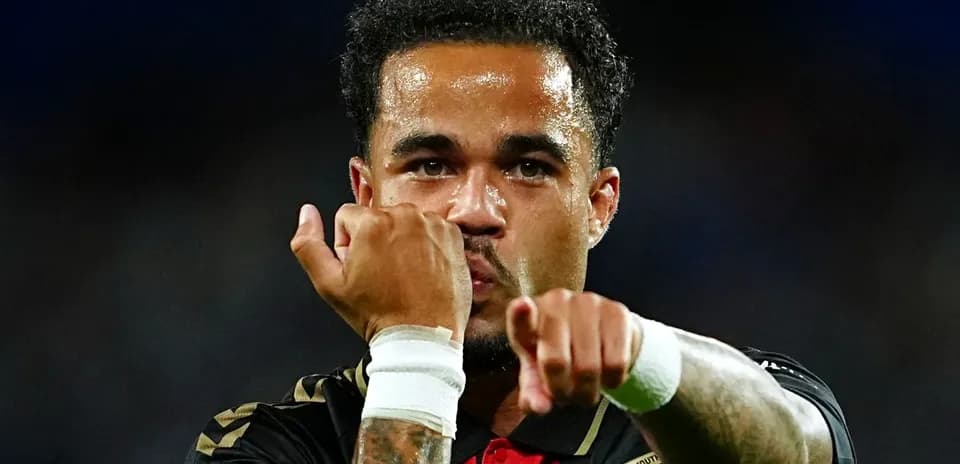 Player celebrating with clenched fists after scoring