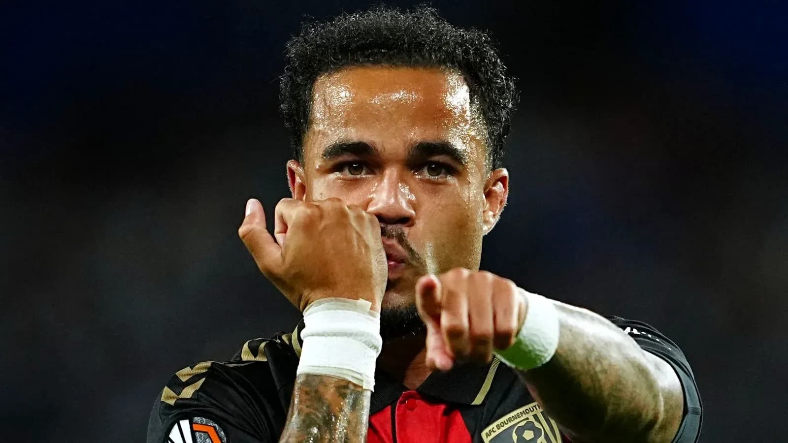 Player celebrating with clenched fists after scoring