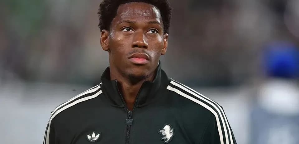 Player in black tracksuit on the field