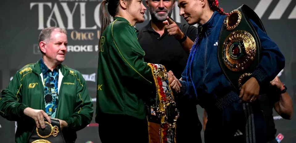 Two boxers shaking hands at press conference