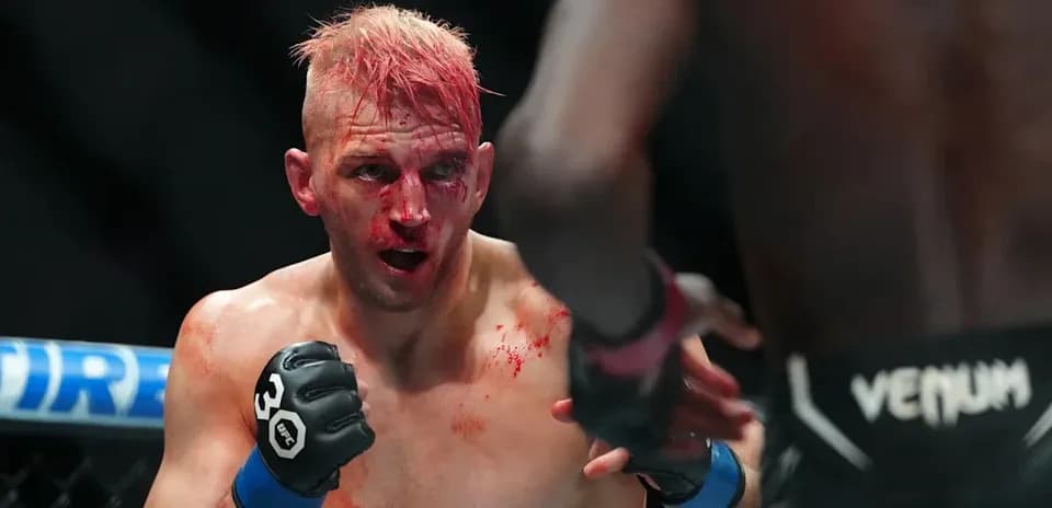 Fighter with blood on face during intense match