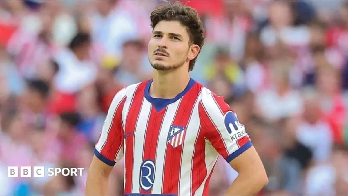 Atletico Madrid player looking concerned on the pitch