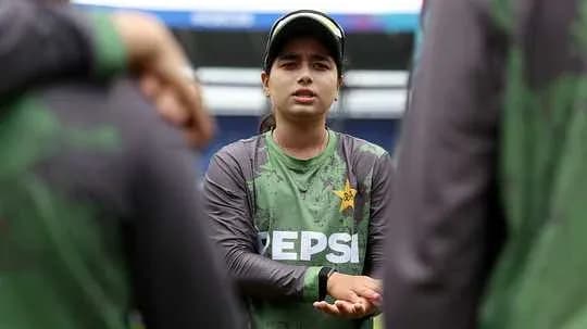 Player discussing strategy with teammates during training