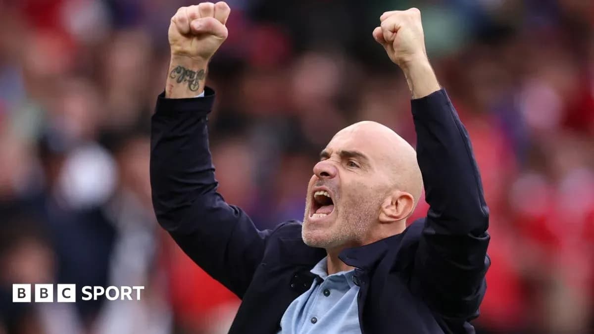 Coach celebrating with raised fists during match