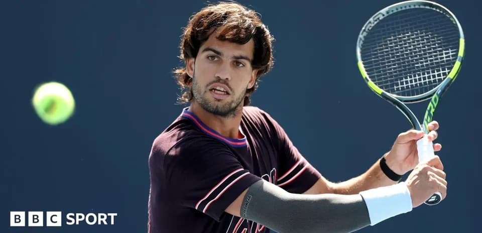 Tennis player preparing to hit a forehand shot