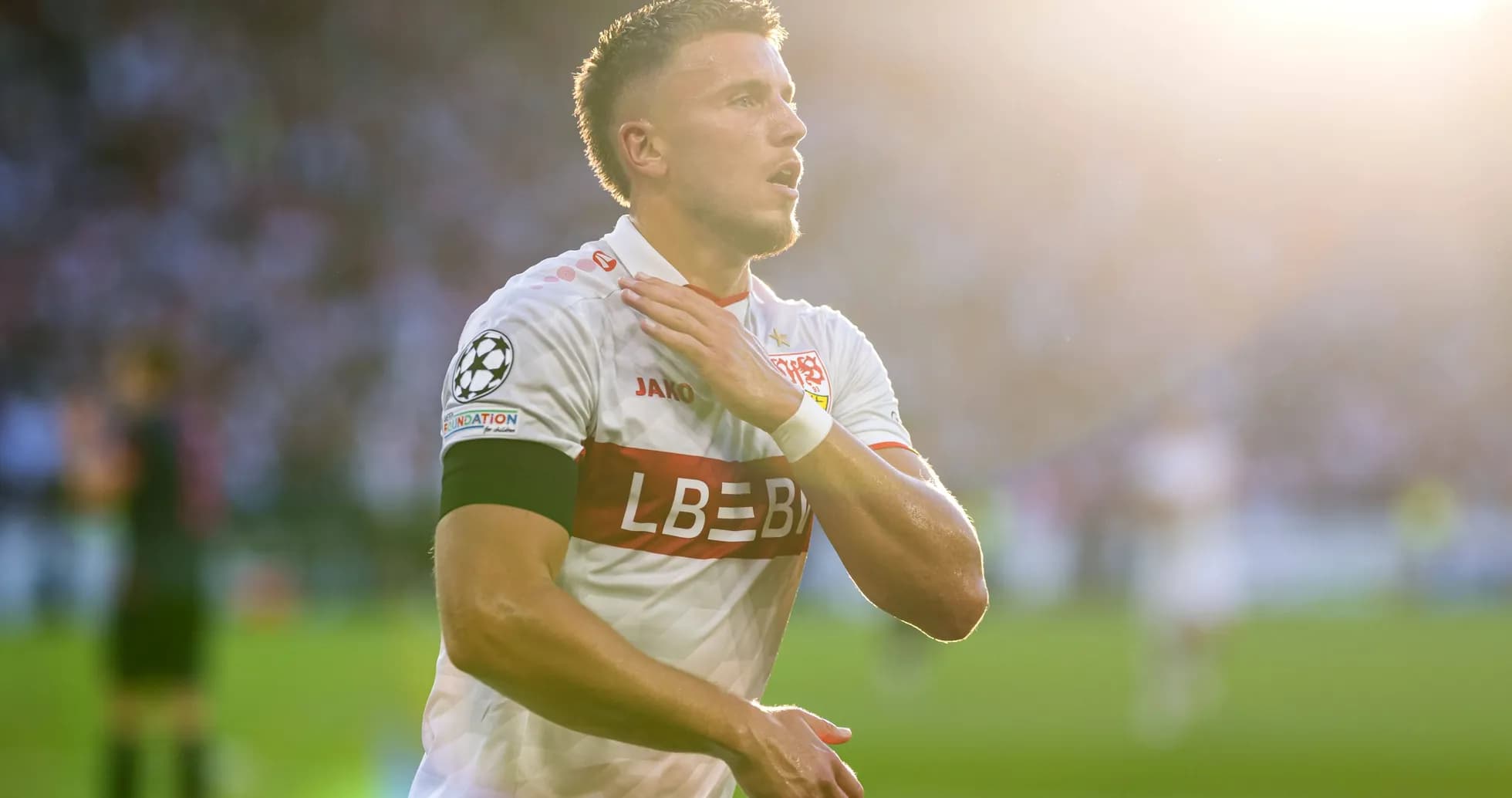 Player celebrating with hand on chest during match