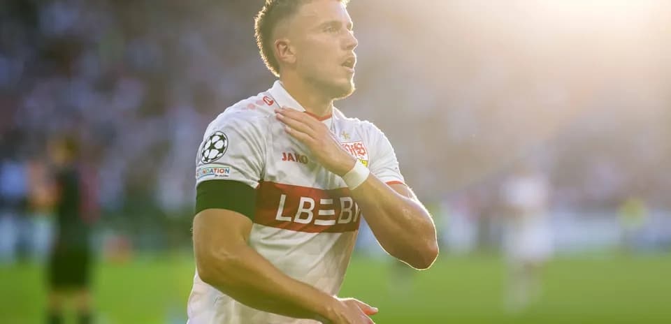 Player celebrating with hand on chest during match