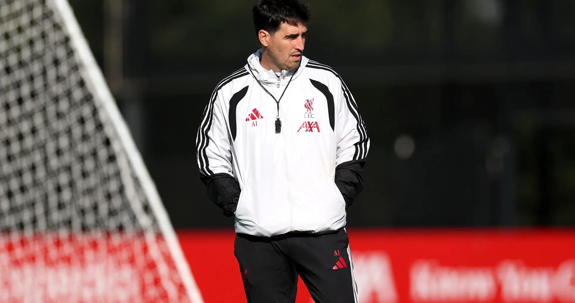 Coach observing players during training session