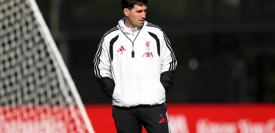 Coach observing players during training session