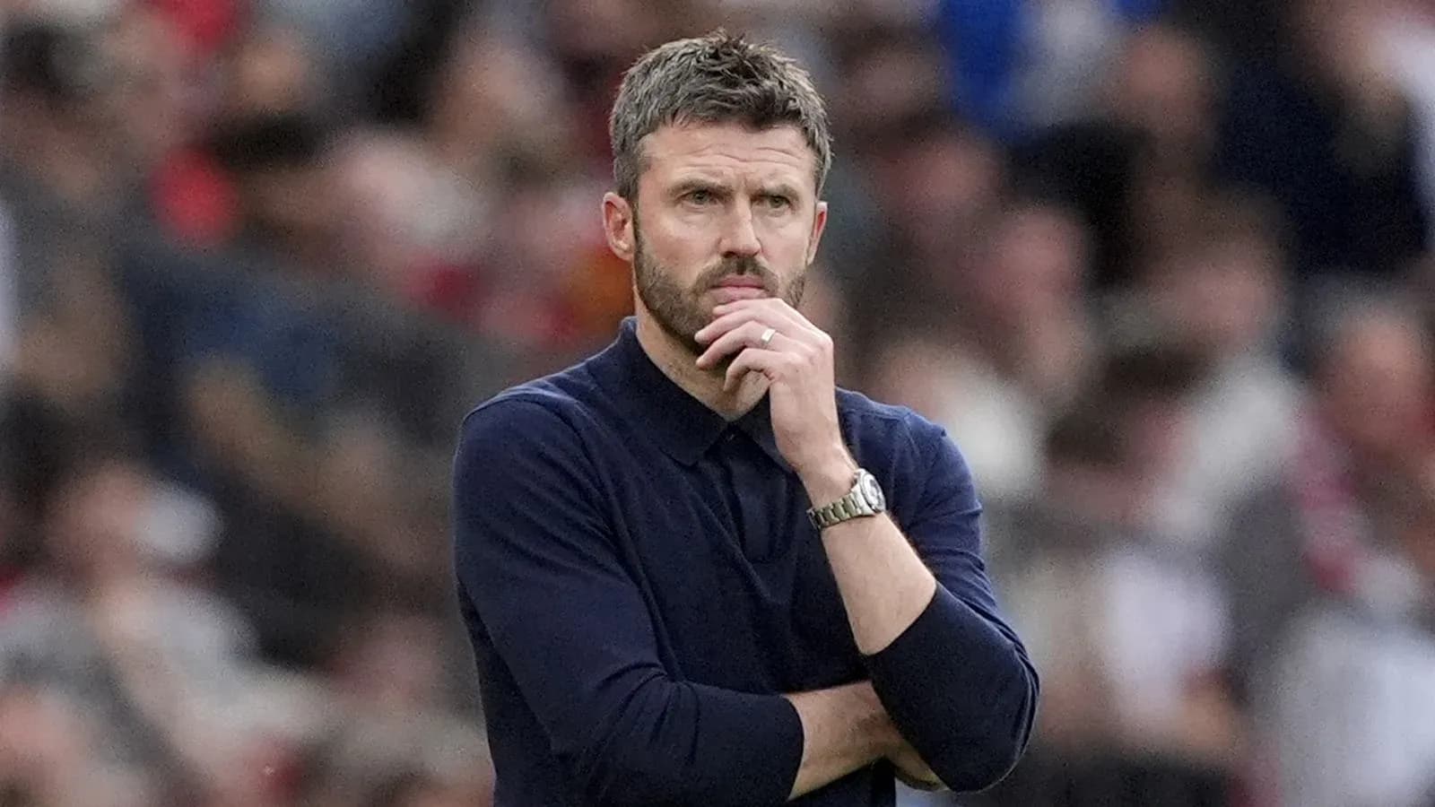 Manager deep in thought during a match