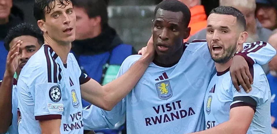 Three Aston Villa players celebrating a goal