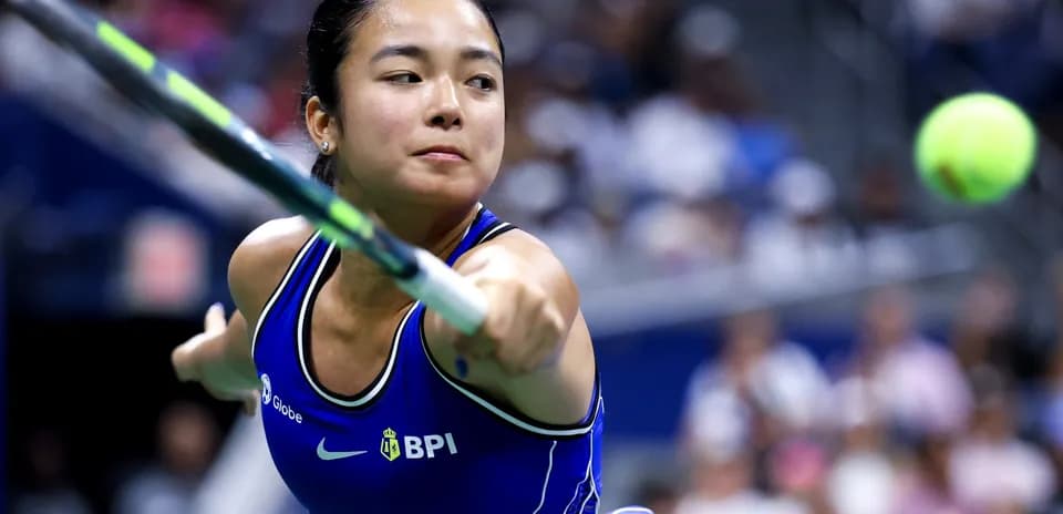 Tennis player hitting a ball during match