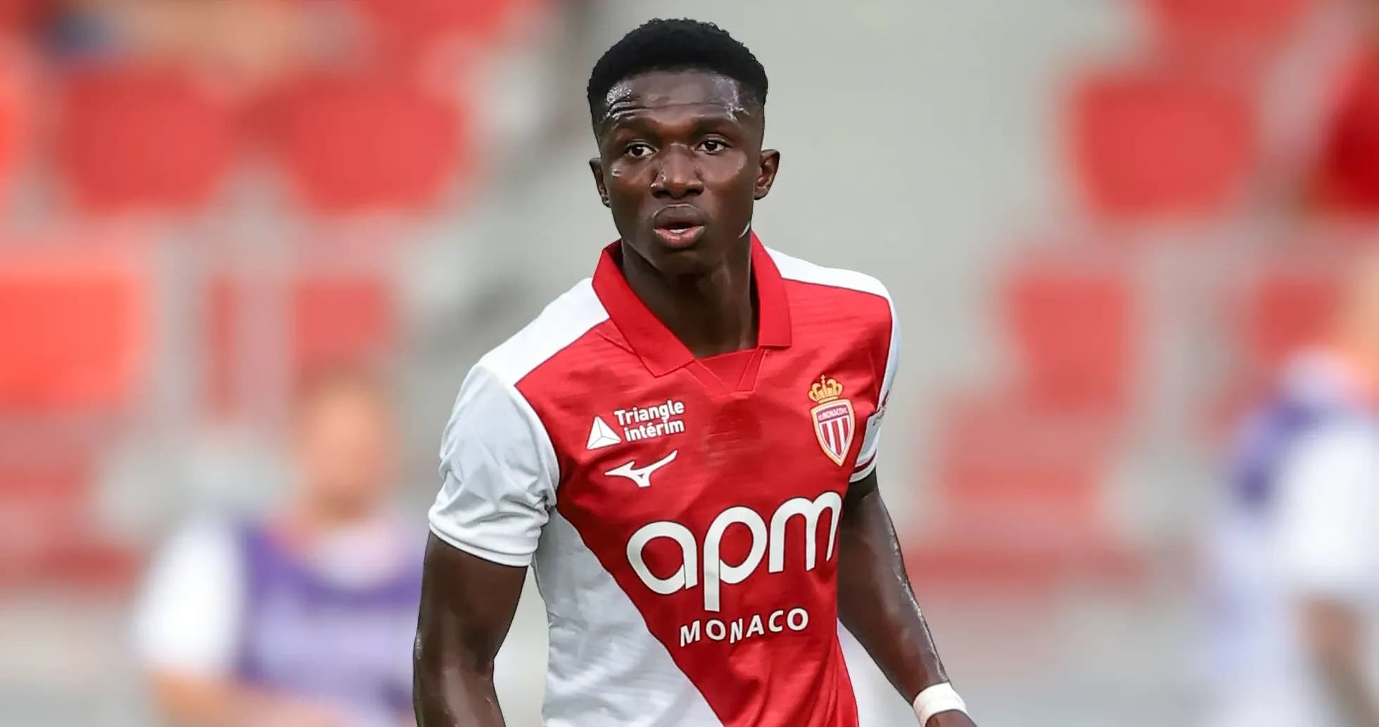 Monaco player in red and white kit on field