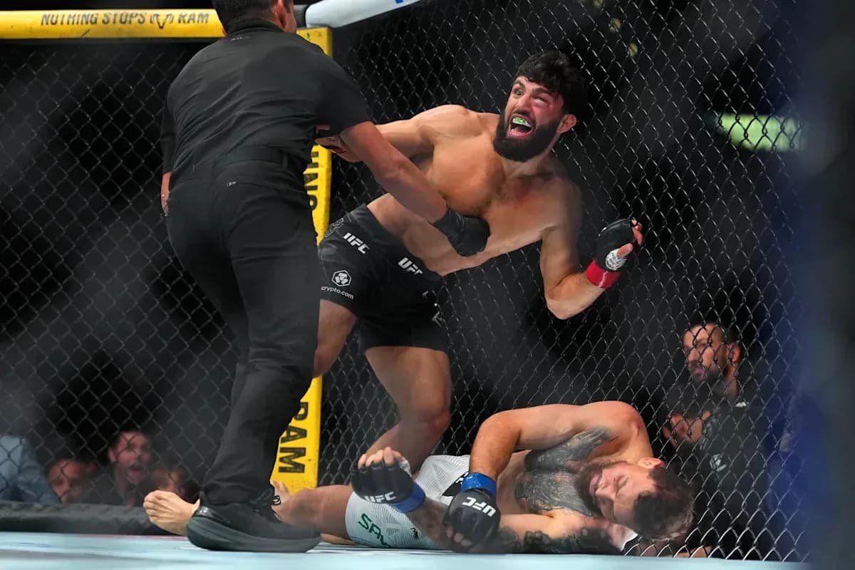 Fighter celebrating after winning match in octagon