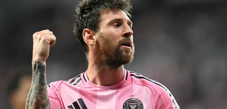 Player celebrating in pink jersey after a match