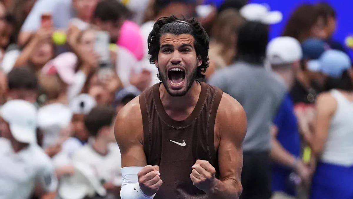 Tennis player celebrating victory with clenched fists